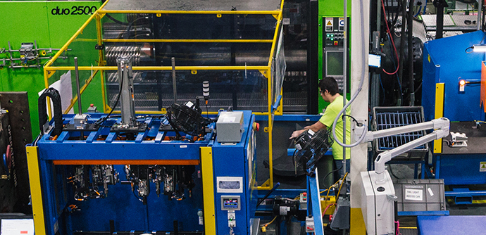 Machine operator in plastics manufacturing facility